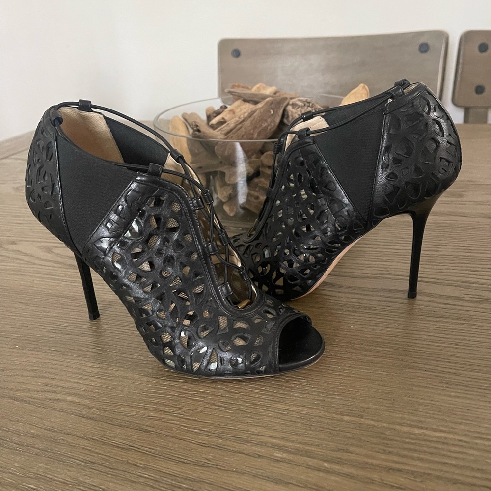 Jimmy Choo Black Heels with Stiletto Design and Intricate Cutouts